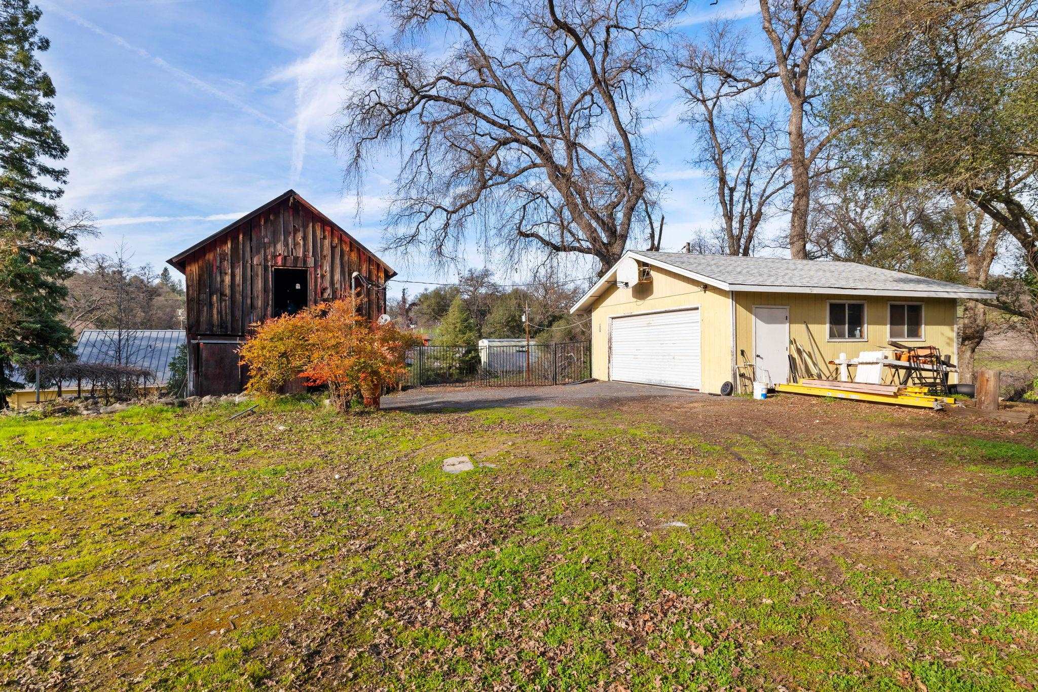 10177 Pulpit Rock Road Jamestown, CA 95327 - Photo 31 of 60 View of home's exterior with an outdoor structure and a garage