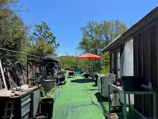 an aerial view of a house with yard