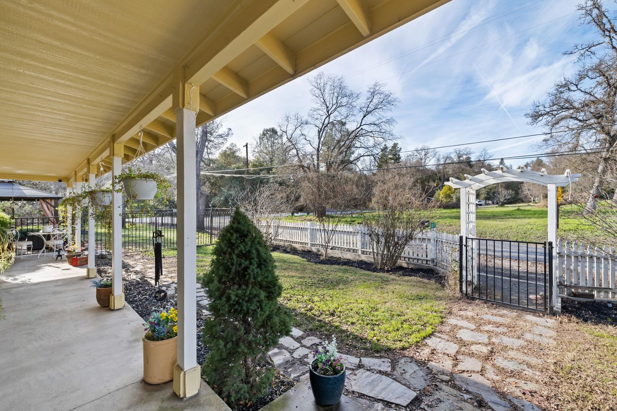 10177 Pulpit Rock Road Jamestown, CA 95327 - Photo 56 of 60 Fenced backyard with a gate and a patio
