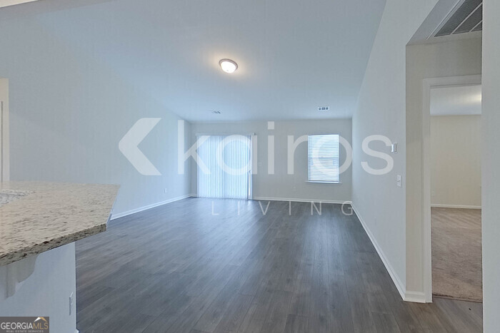 108 St Phillip Way Springfield, GA 31329 - Photo 13 of 29 a view of an empty room with wooden floor and cabinet