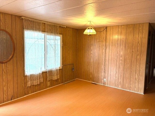 12200 Stone Way North, Unit 74 Seattle, WA 98133 - Photo 7 of 14 a view of a room with large windows and chandelier fan