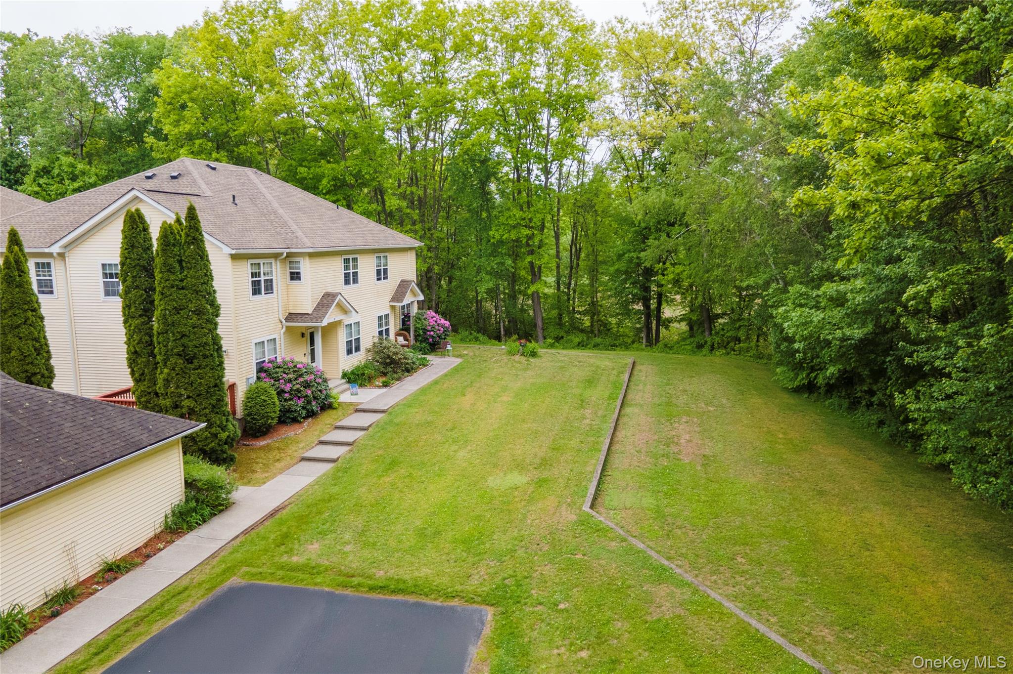129 Stringham Road, Unit 31 LaGrangeville, NY 12540 - Photo 23 of 26 a view of a house with pool