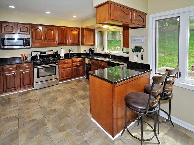 43 Holland Road Churchill, PA 15235 - Photo 2 of 25 Beautiful EIK with counter area, and table area for meals. All SS applicances and granite counters. Open and lots of sun light coming in.