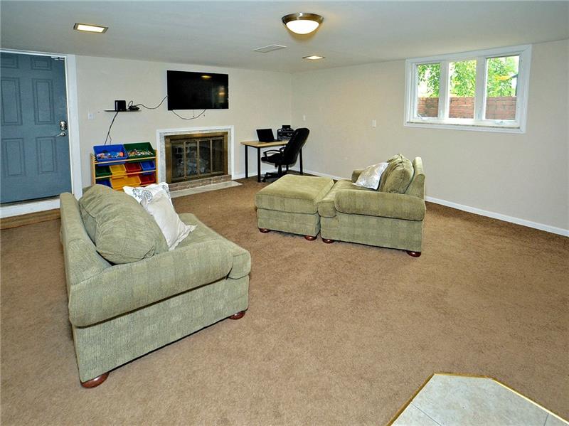 43 Holland Road Churchill, PA 15235 - Photo 21 of 25 Finished Gameroom with gas fireplace and Bar area for entertaining.
