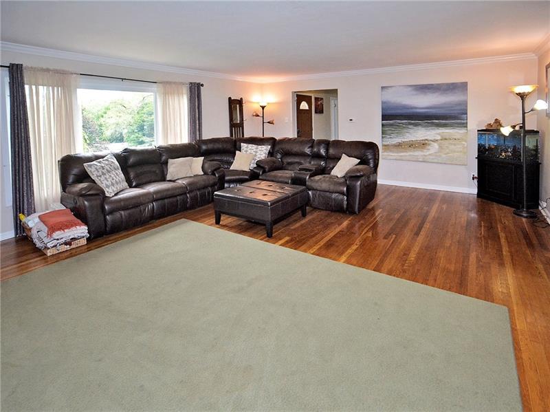 43 Holland Road Churchill, PA 15235 - Photo 10 of 25 Large Living room with beautiful hardwood floors. Gas fireplace.