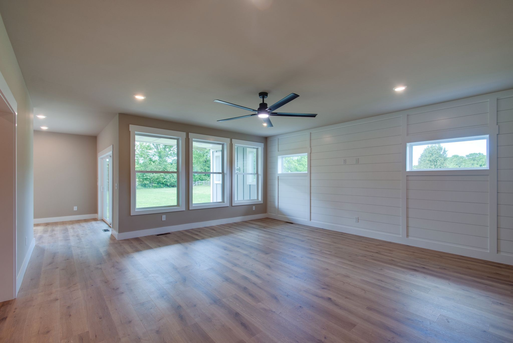 3333 Booker Ridge Road Mount Pleasant, TN 38474 - Photo 15 of 43 a view of an empty room with wooden floor and a window