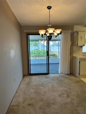 a view of a kitchen with a sink wooden floor and windows