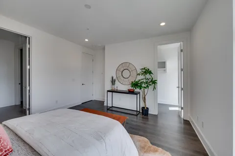 a bedroom with bed and window