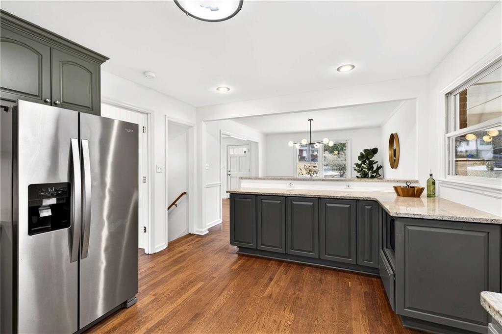 632 Willivee Drive Decatur, GA 30033 - Photo 14 of 44 a kitchen with stainless steel appliances granite countertop a refrigerator a sink and a stove