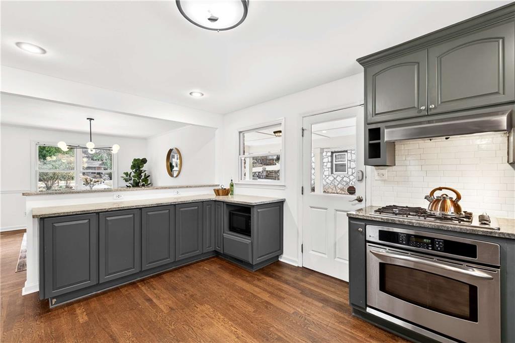 632 Willivee Drive Decatur, GA 30033 - Photo 15 of 44 a kitchen with a sink stove and cabinets