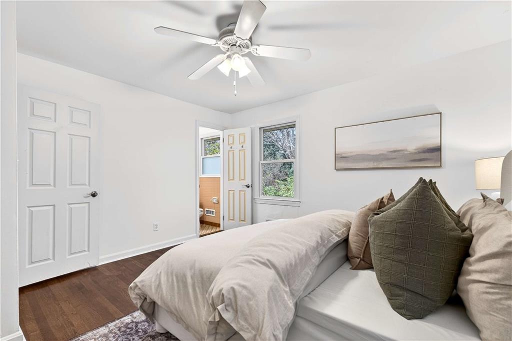 632 Willivee Drive Decatur, GA 30033 - Photo 24 of 44 a bedroom with a large bed and a chandelier