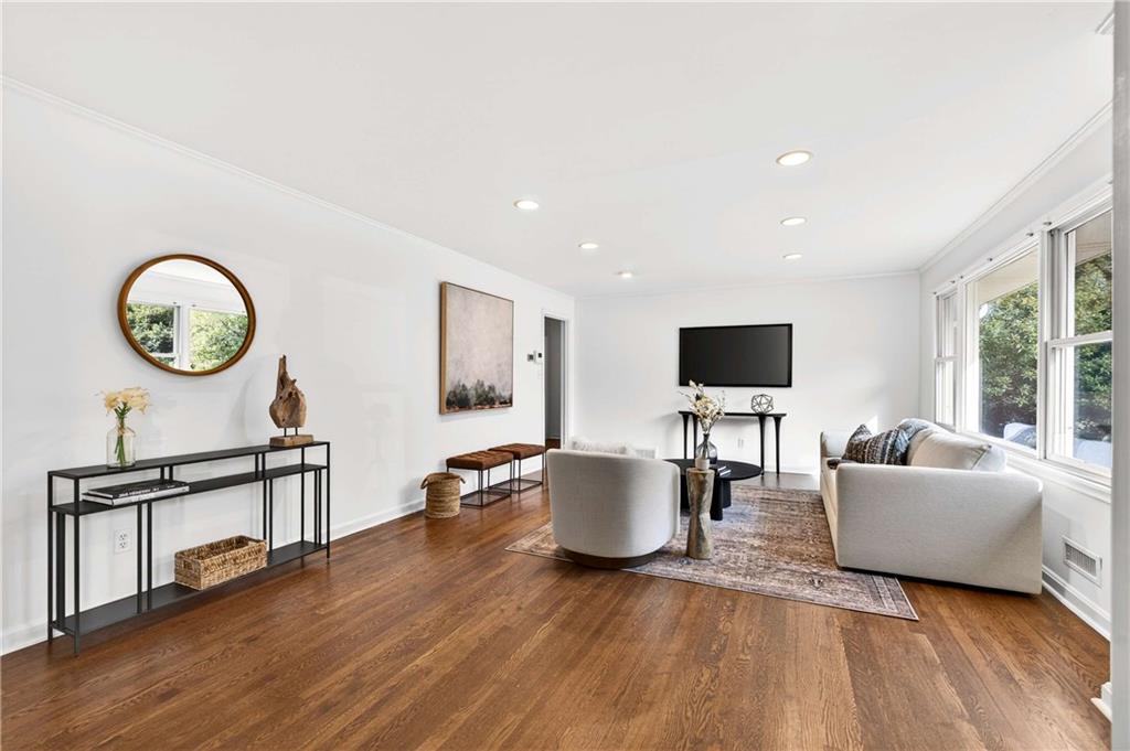 632 Willivee Drive Decatur, GA 30033 - Photo 6 of 44 a living room with furniture a window and a flat screen tv