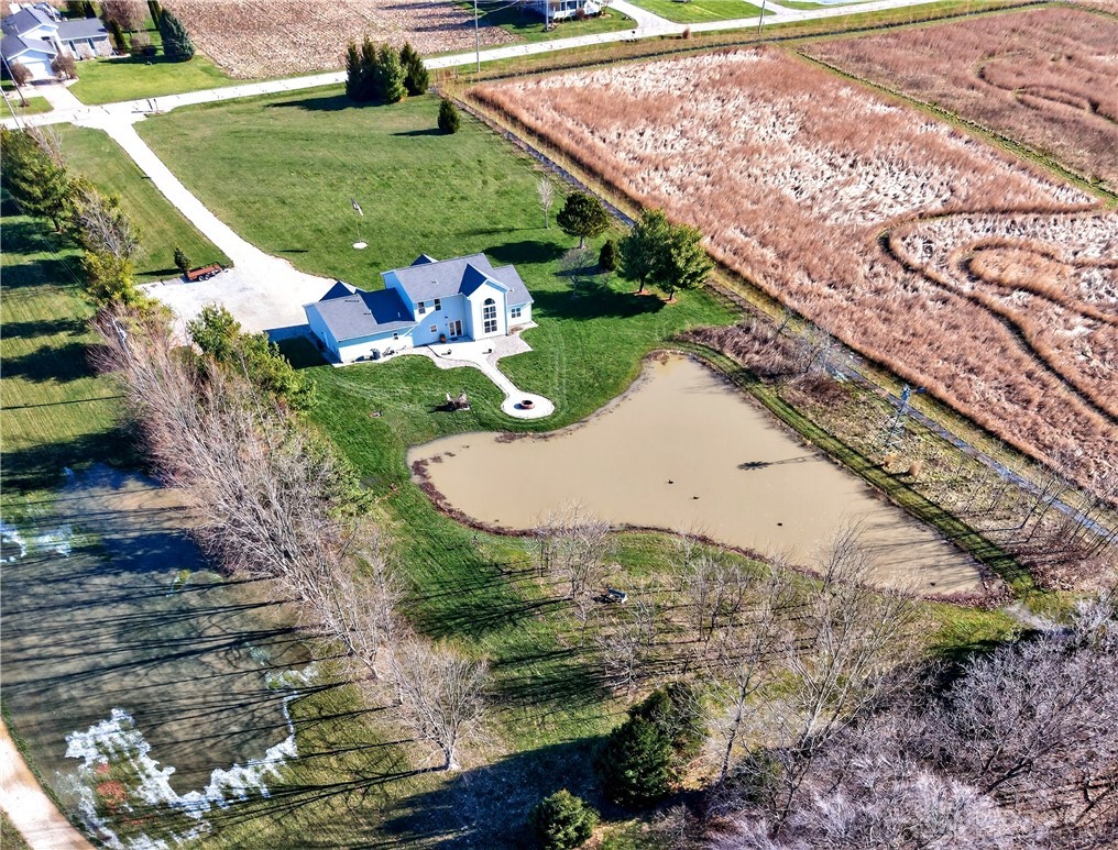 6560 Snyder Road Fletcher, OH 45326 - Photo 64 of 71 This expansive estate features a private pond and lush green grounds, ideal for outdoor enjoyment.