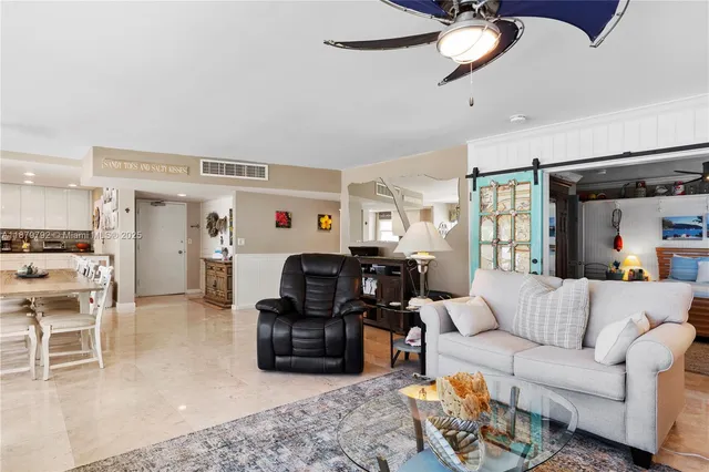 a kitchen with stainless steel appliances a refrigerator sink and cabinets
