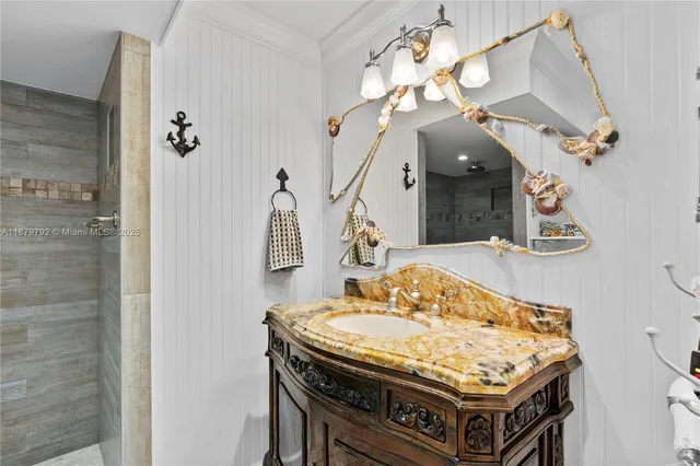 a kitchen with a stove and a chandelier