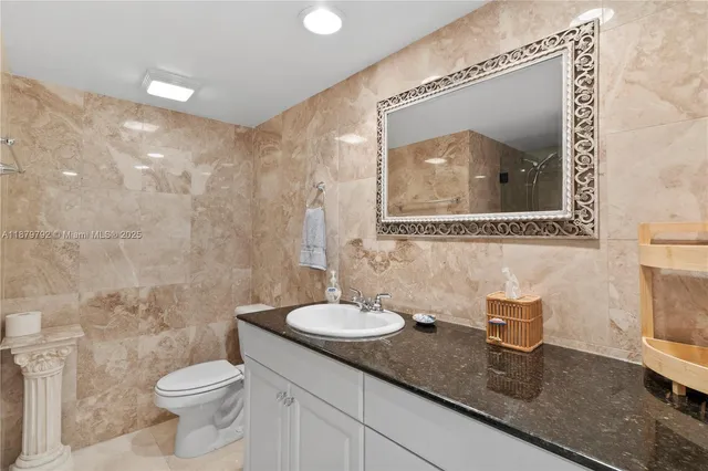 a bathroom with a shower and a sink