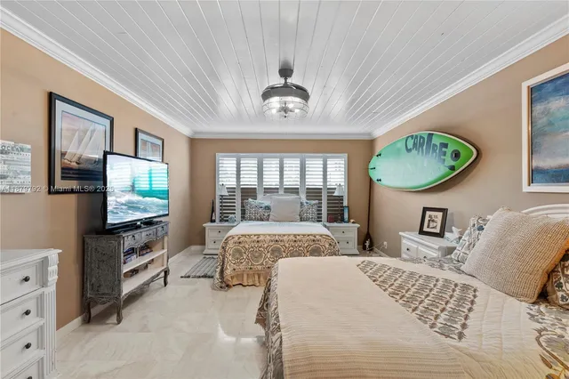 a bedroom with bed and a window