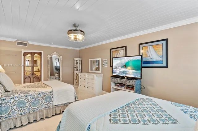 a bathroom with a granite countertop sink a mirror a vanity and a shower