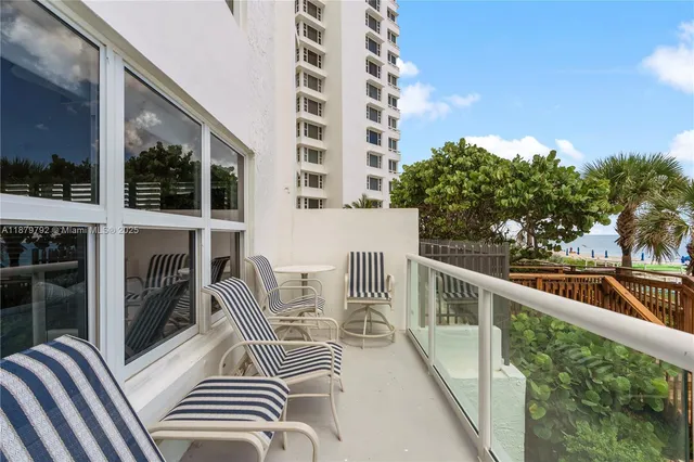 a room with lots of furniture and a large window