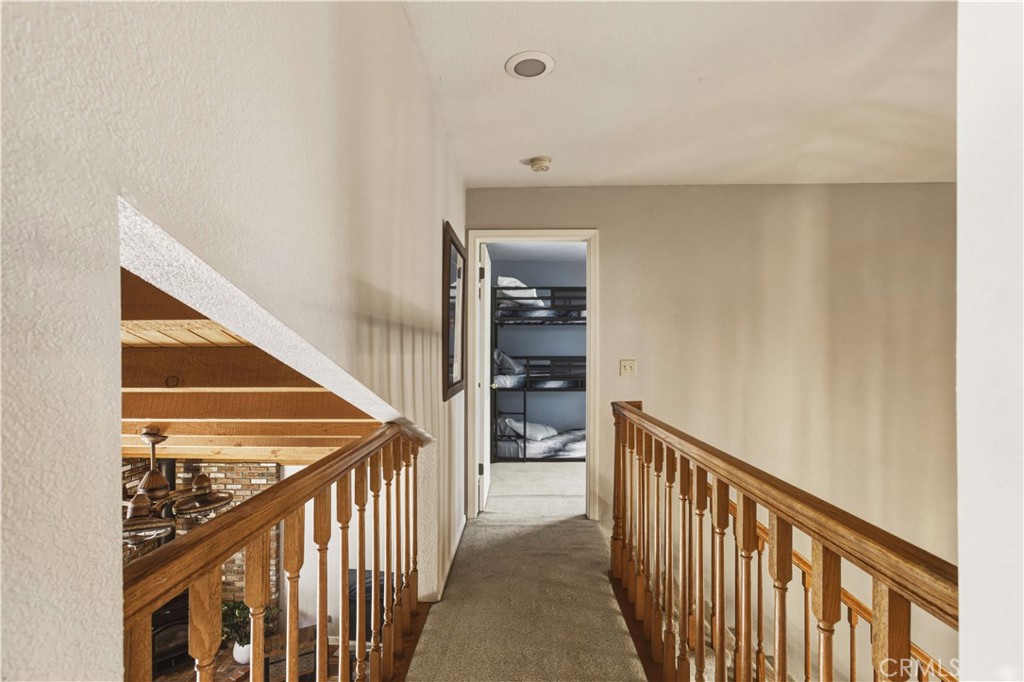 3856 North Gardner Avenue Merced, CA 95340 - Photo 39 of 59 a view of a hallway with wooden floor and stairs