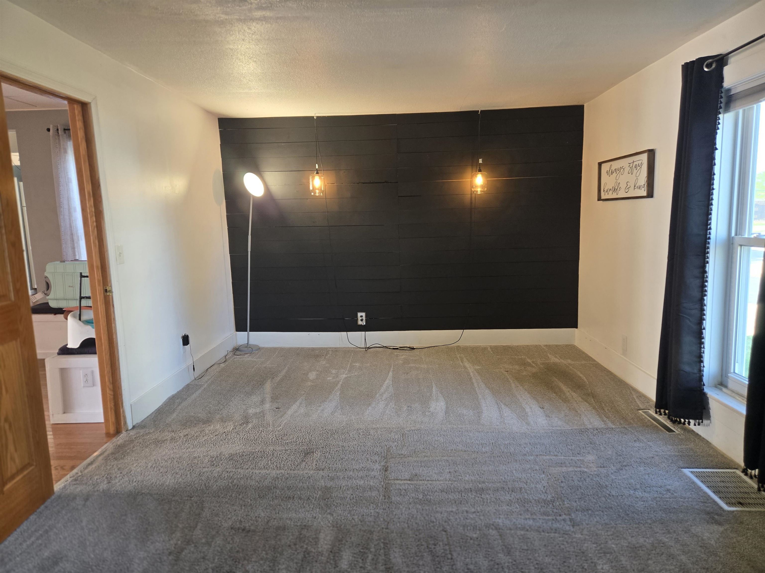 732 West 2nd Street Byron, IL 61010 - Photo 9 of 22 a view of a livingroom with a staircase