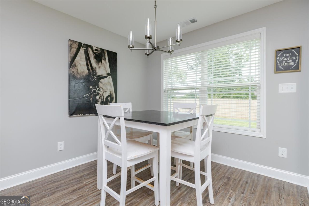 104 Meredith Layne Court Perry, GA 31069 - Photo 21 of 46 a view of a dining room with furniture window and wooden floor
