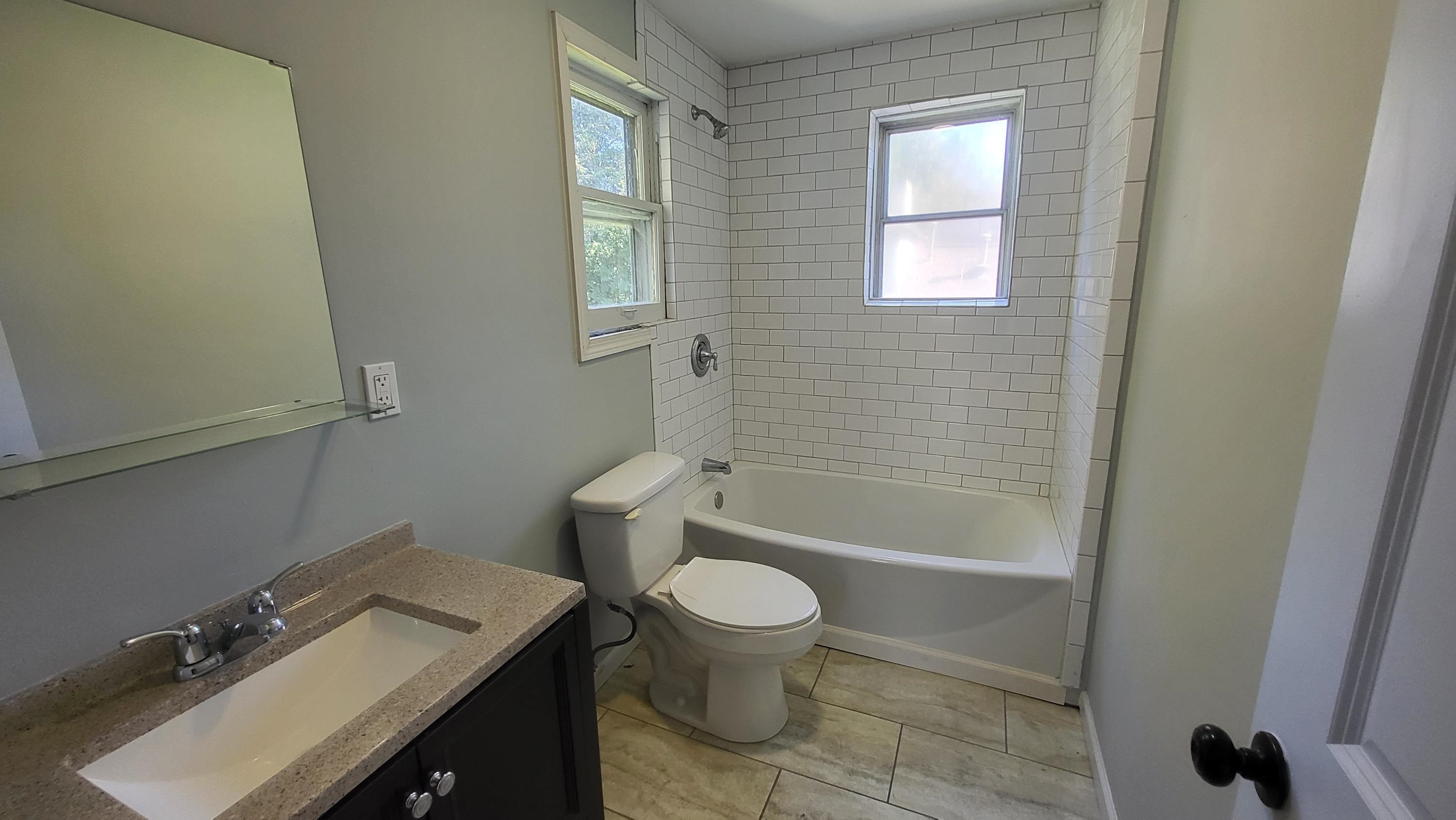 1844 Oliver Avenue Memphis, TN 38114 - Photo 14 of 18 a bathroom with a sink a toilet and shower