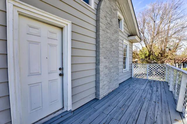 a view of an entryway door with wooden floor