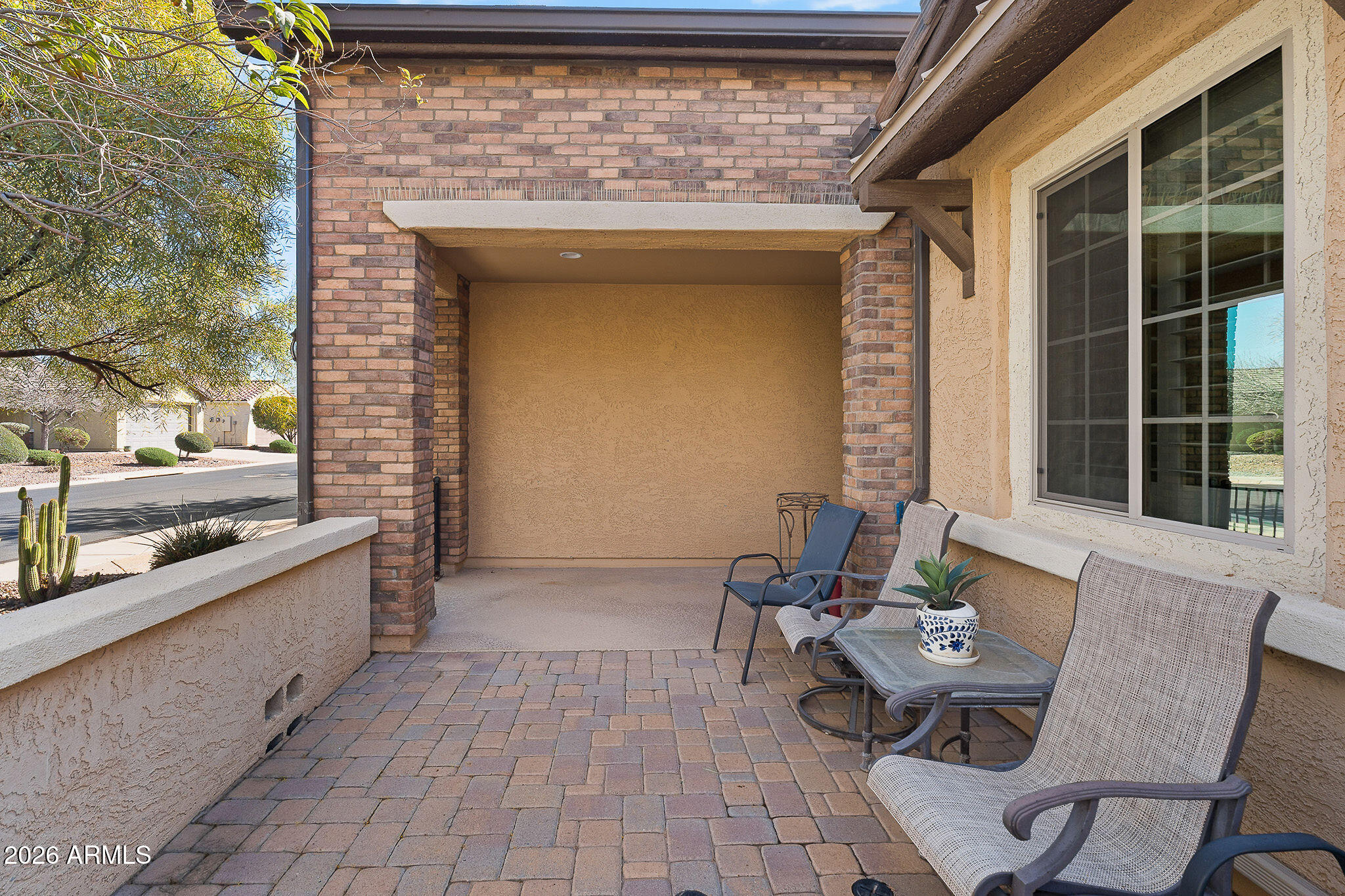 7337 West Silver Spring Way Florence, AZ 85132 - Photo 13 of 60 a view of a patio with table and chairs near a barbeque