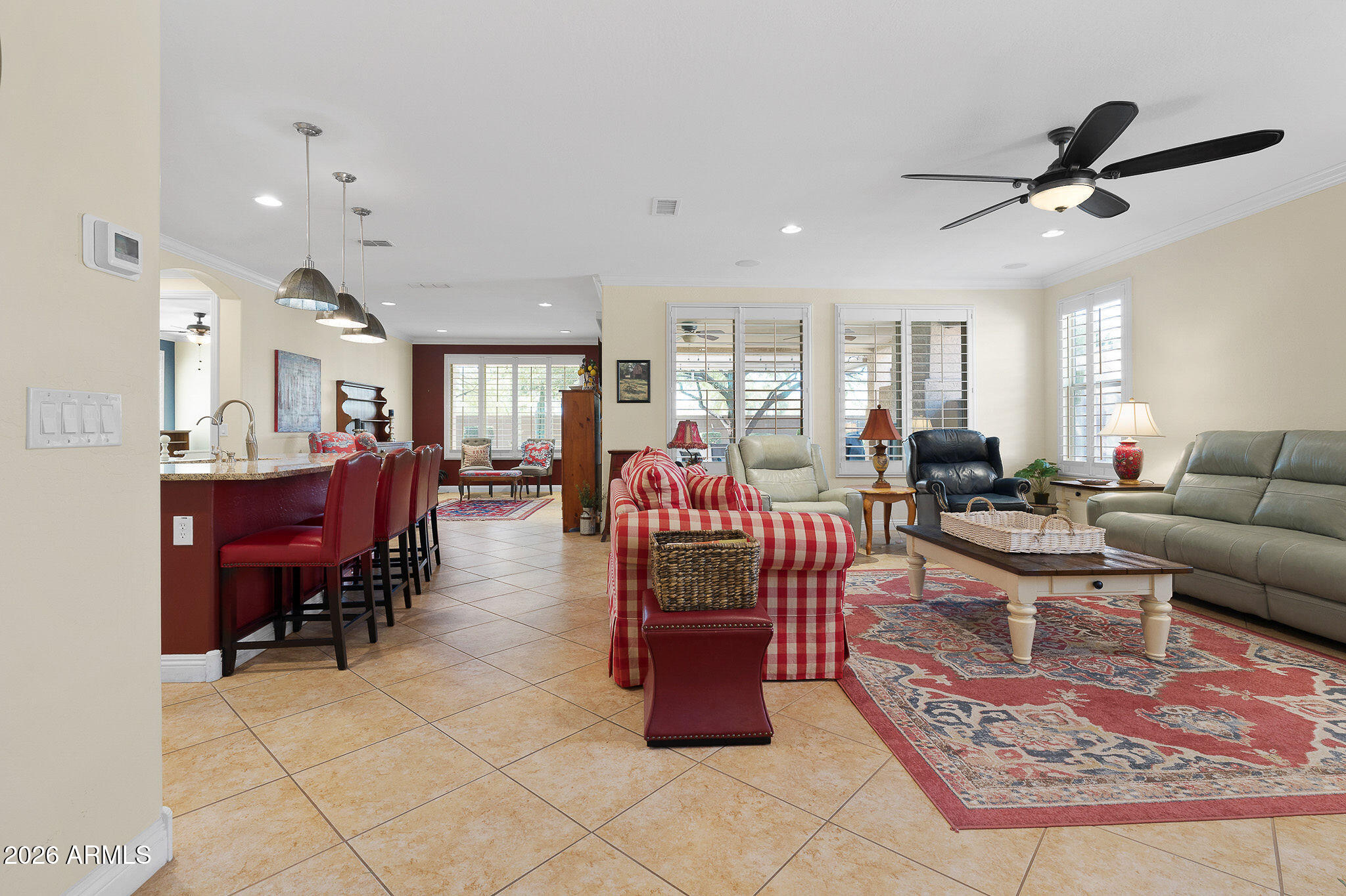 7337 West Silver Spring Way Florence, AZ 85132 - Photo 16 of 60 a living room with furniture and a view of kitchen
