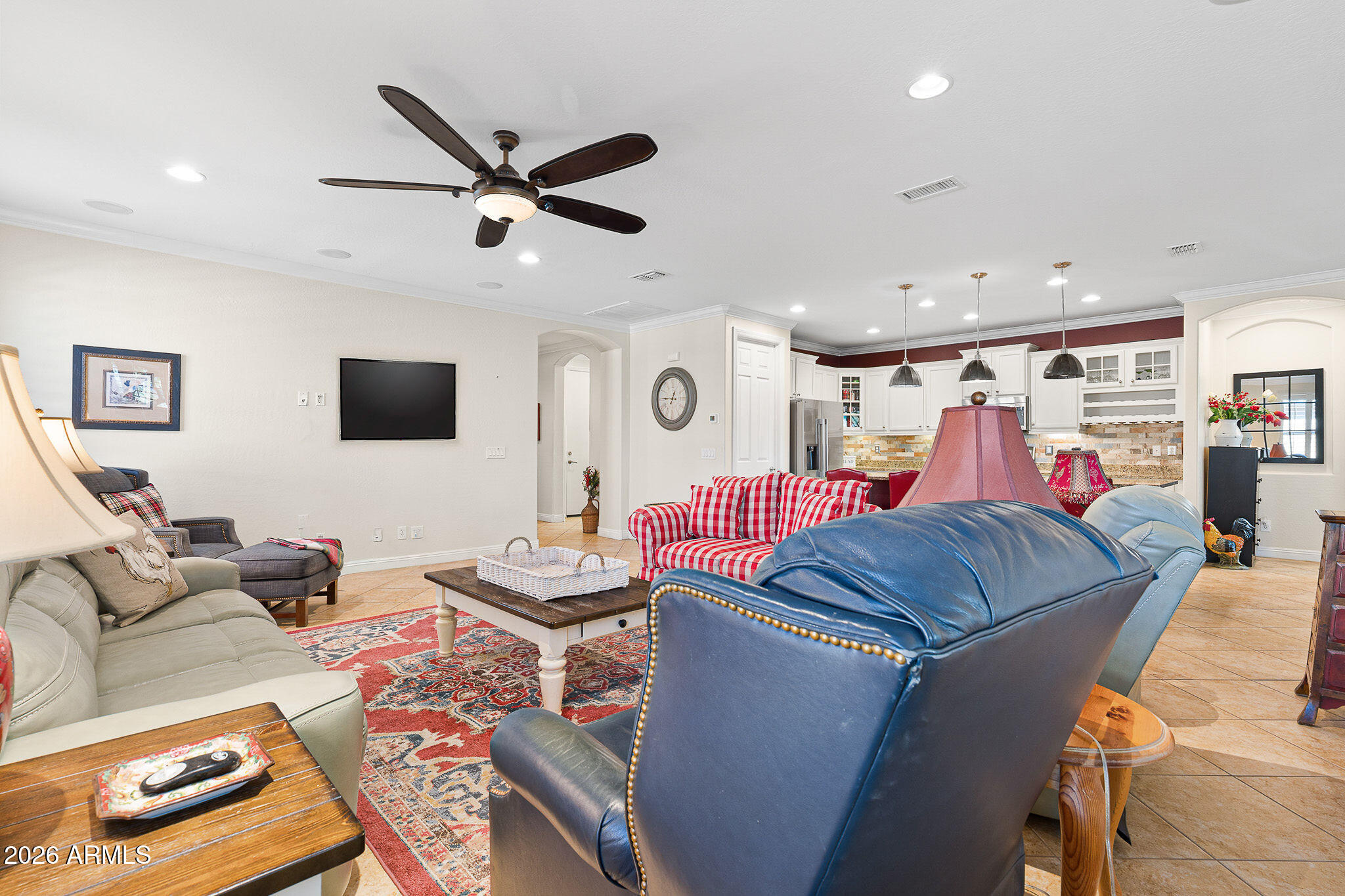 7337 West Silver Spring Way Florence, AZ 85132 - Photo 20 of 60 a living room with furniture and a flat screen tv