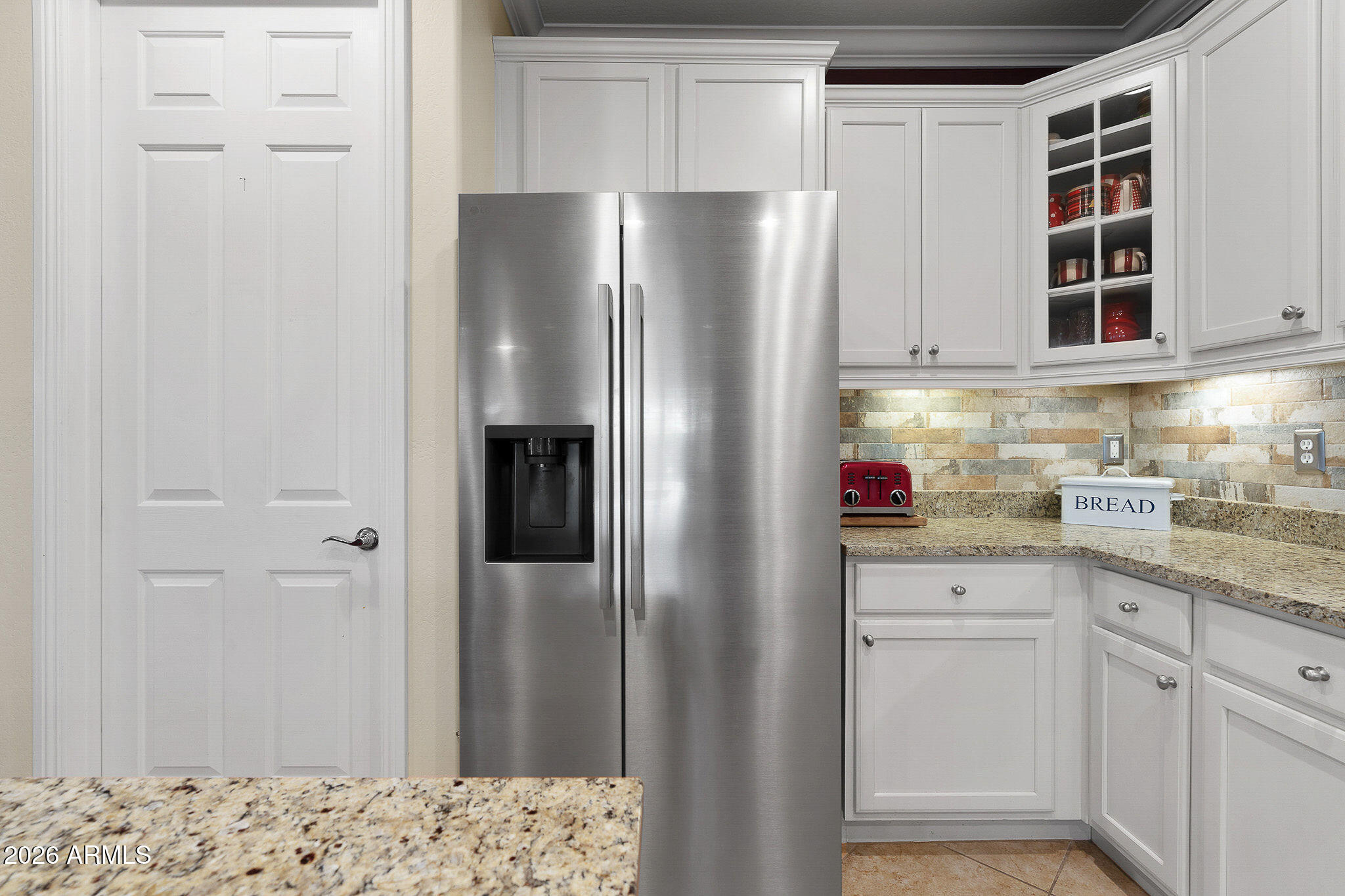 7337 West Silver Spring Way Florence, AZ 85132 - Photo 30 of 60 a kitchen with stainless steel appliances granite countertop a refrigerator and a sink