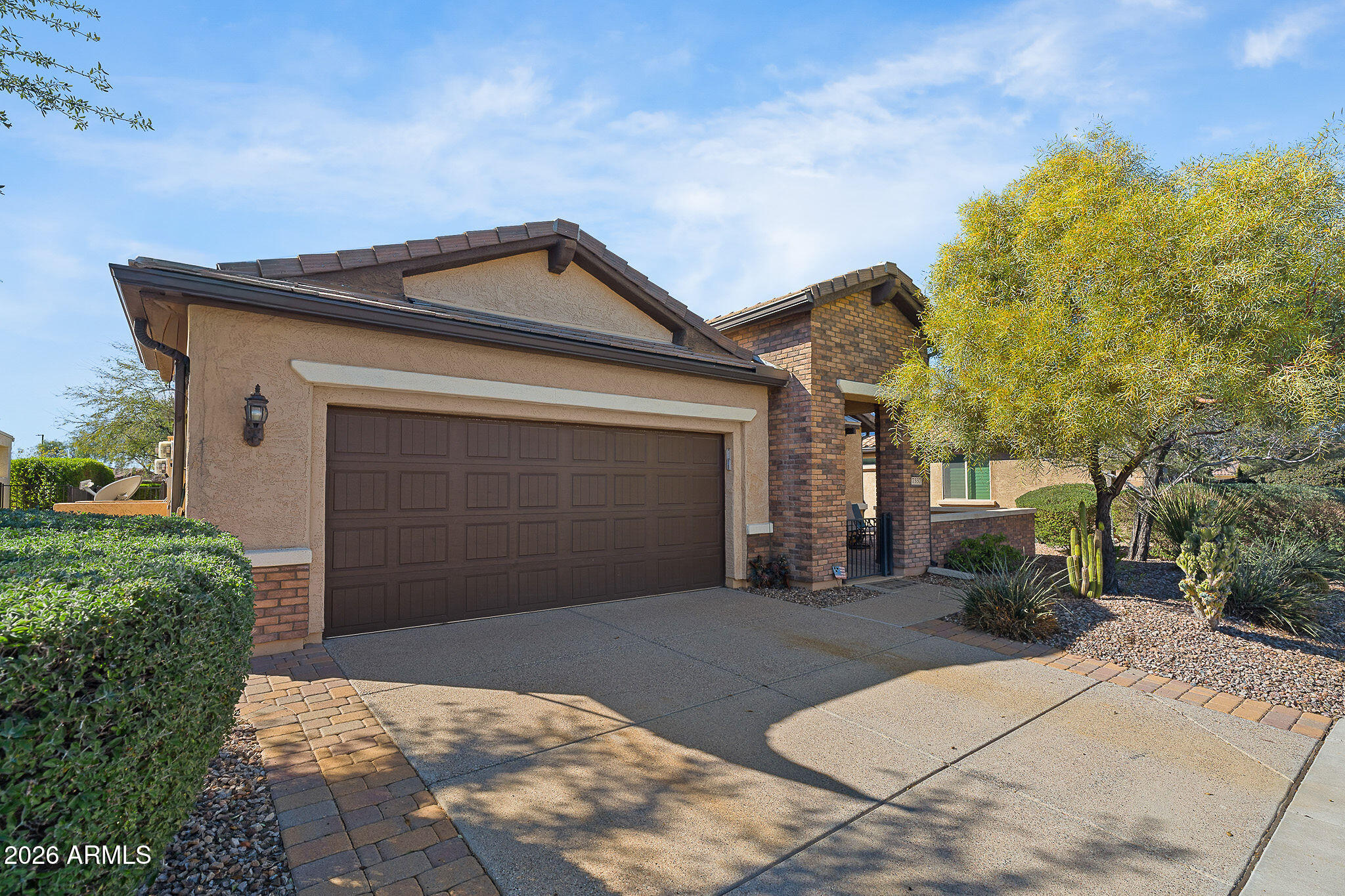 7337 West Silver Spring Way Florence, AZ 85132 - Photo 3 of 60 a front view of a house with a yard