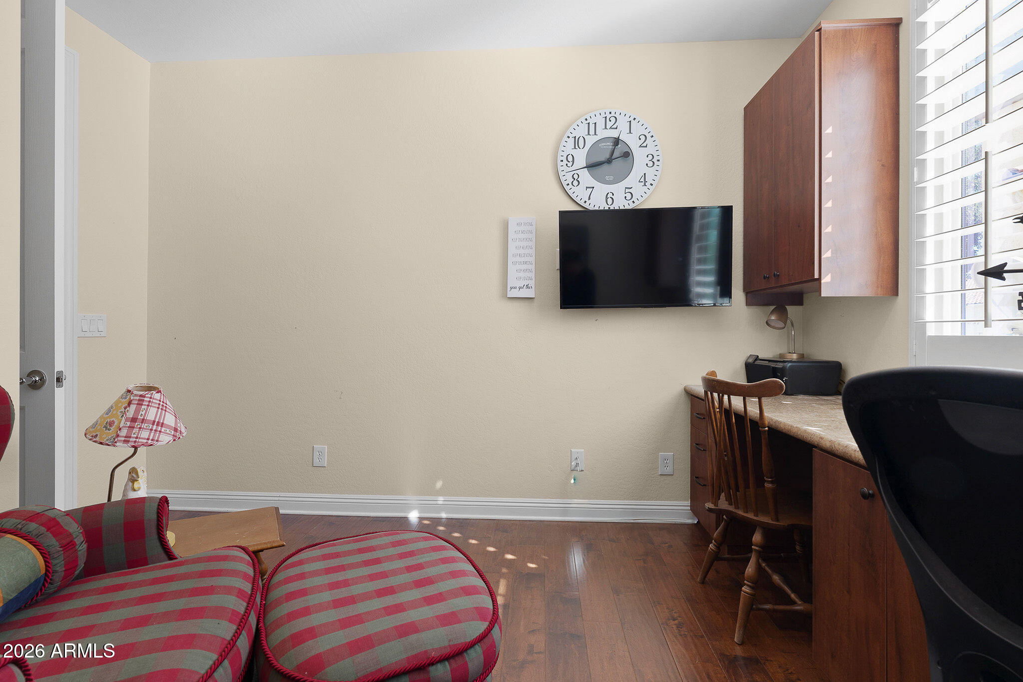 7337 West Silver Spring Way Florence, AZ 85132 - Photo 38 of 60 a room with a couch and a flat screen tv