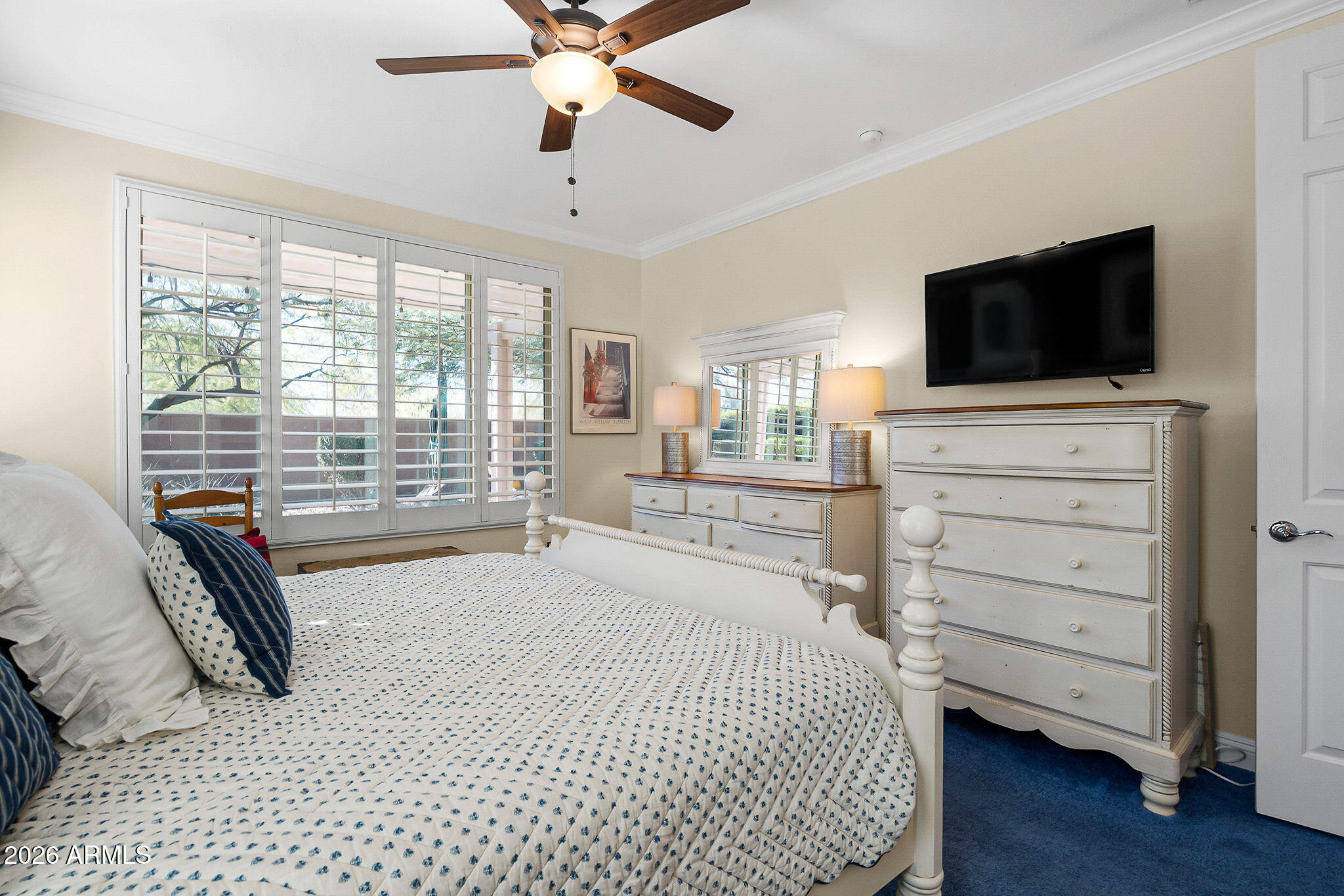 7337 West Silver Spring Way Florence, AZ 85132 - Photo 43 of 60 a bedroom with a bed and a flat screen tv
