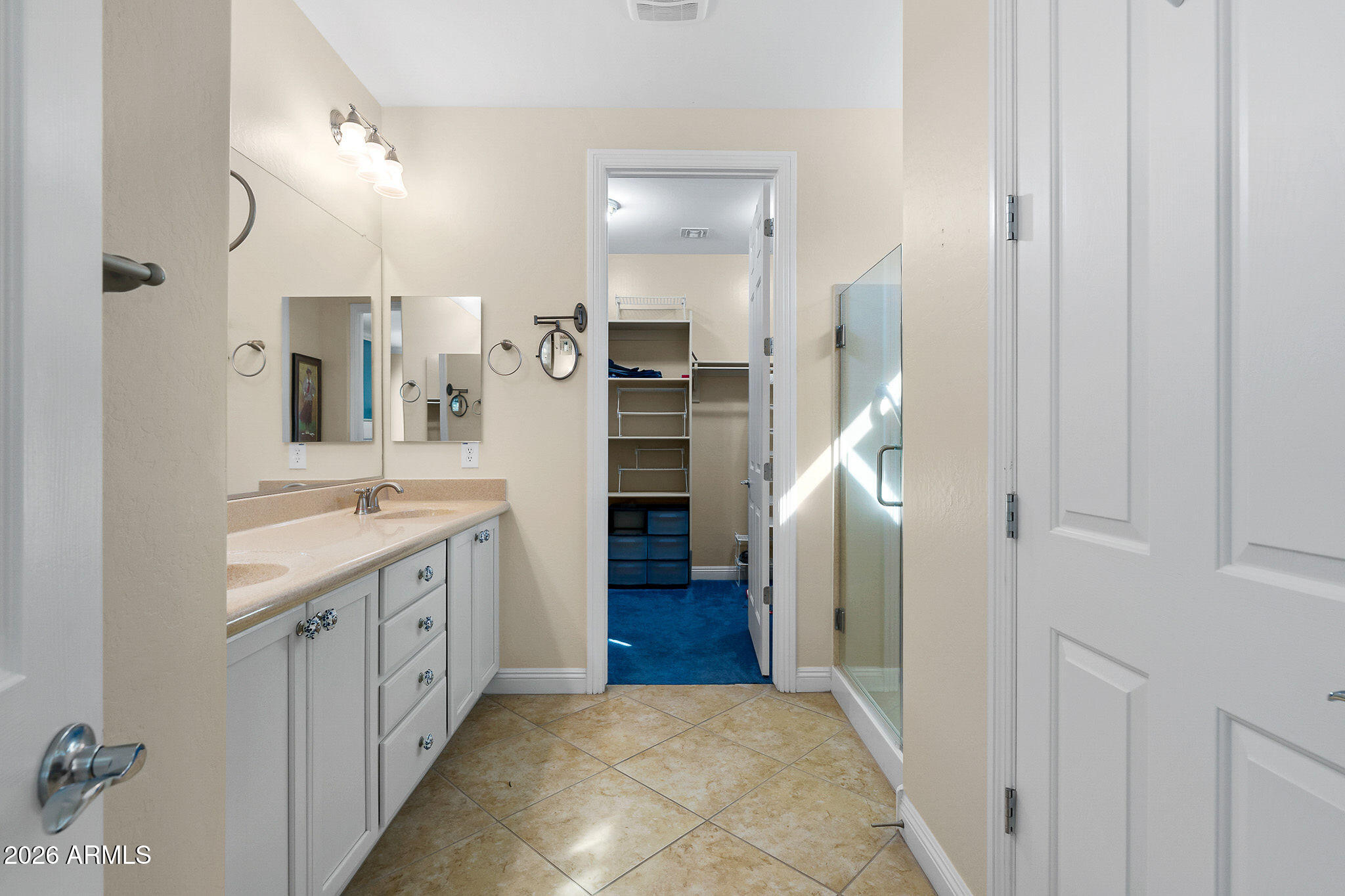 7337 West Silver Spring Way Florence, AZ 85132 - Photo 44 of 60 a bathroom with a sink a toilet and a large mirror