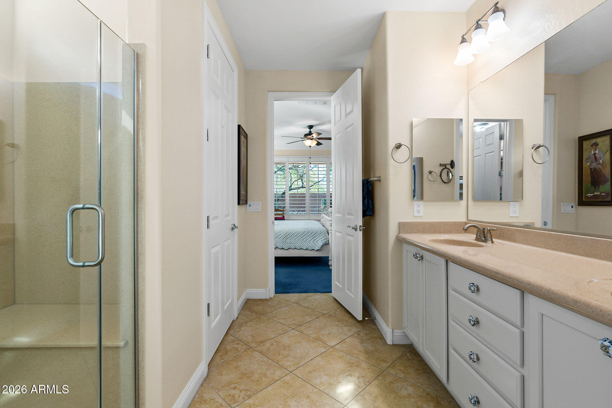 7337 West Silver Spring Way Florence, AZ 85132 - Photo 45 of 60 a en suite bathroom with a granite countertop sink mirror and shower