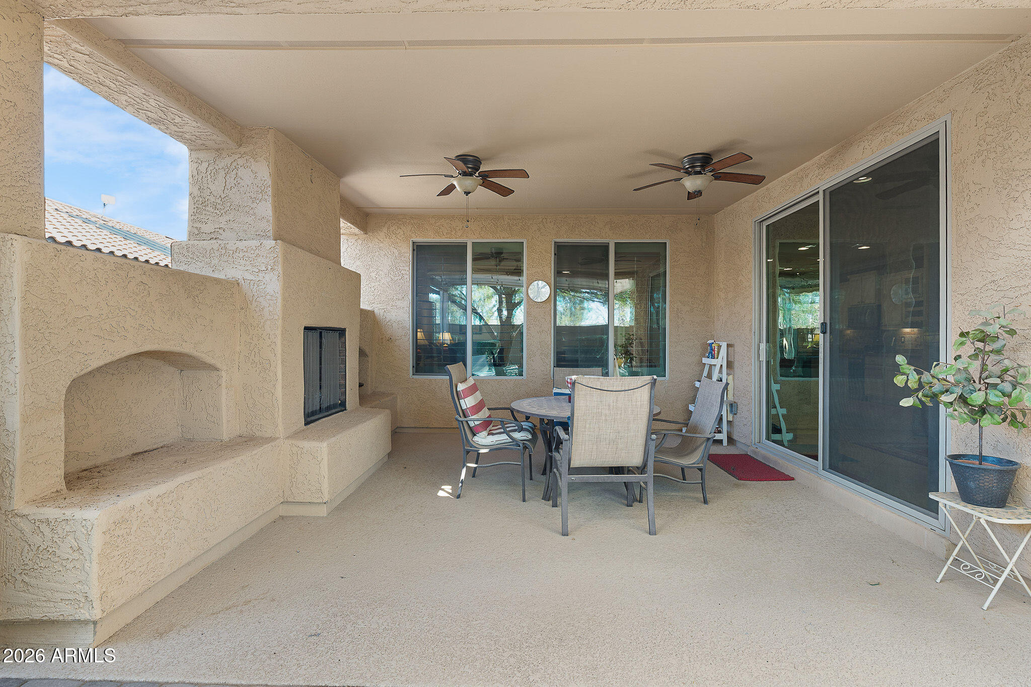 7337 West Silver Spring Way Florence, AZ 85132 - Photo 58 of 60 a living room with furniture and a potted plant