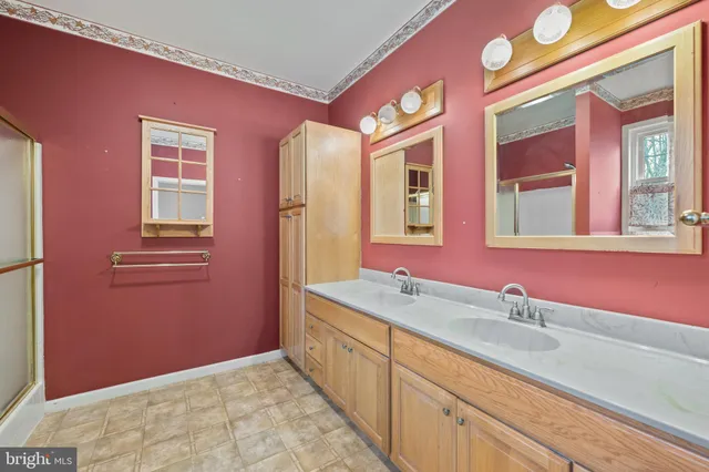 a bathroom with a sink a mirror and a bathtub