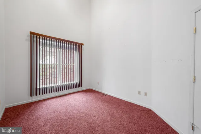 a view of a livingroom with a floor to ceiling window