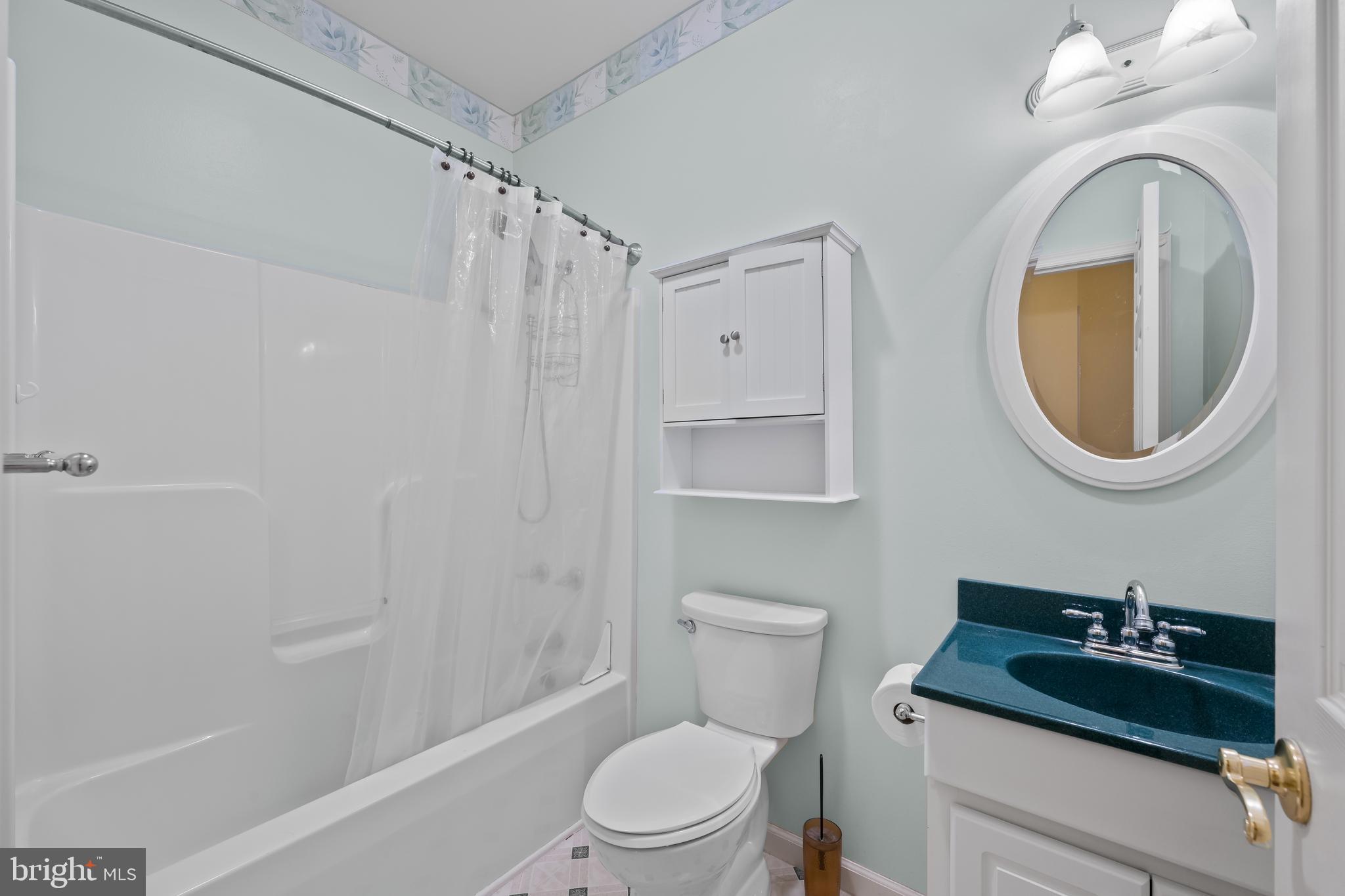1 Pinewood Circle Hazleton, PA 18202 - Photo 24 of 33 a bathroom with a sink a toilet and a mirror