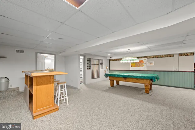 a reading room with furniture and window