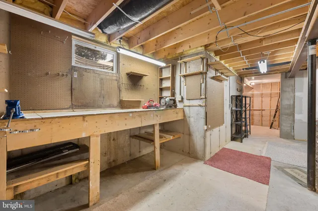 a kitchen with refrigerator and cabinets