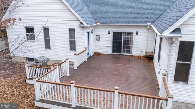 a view of a house with wooden deck