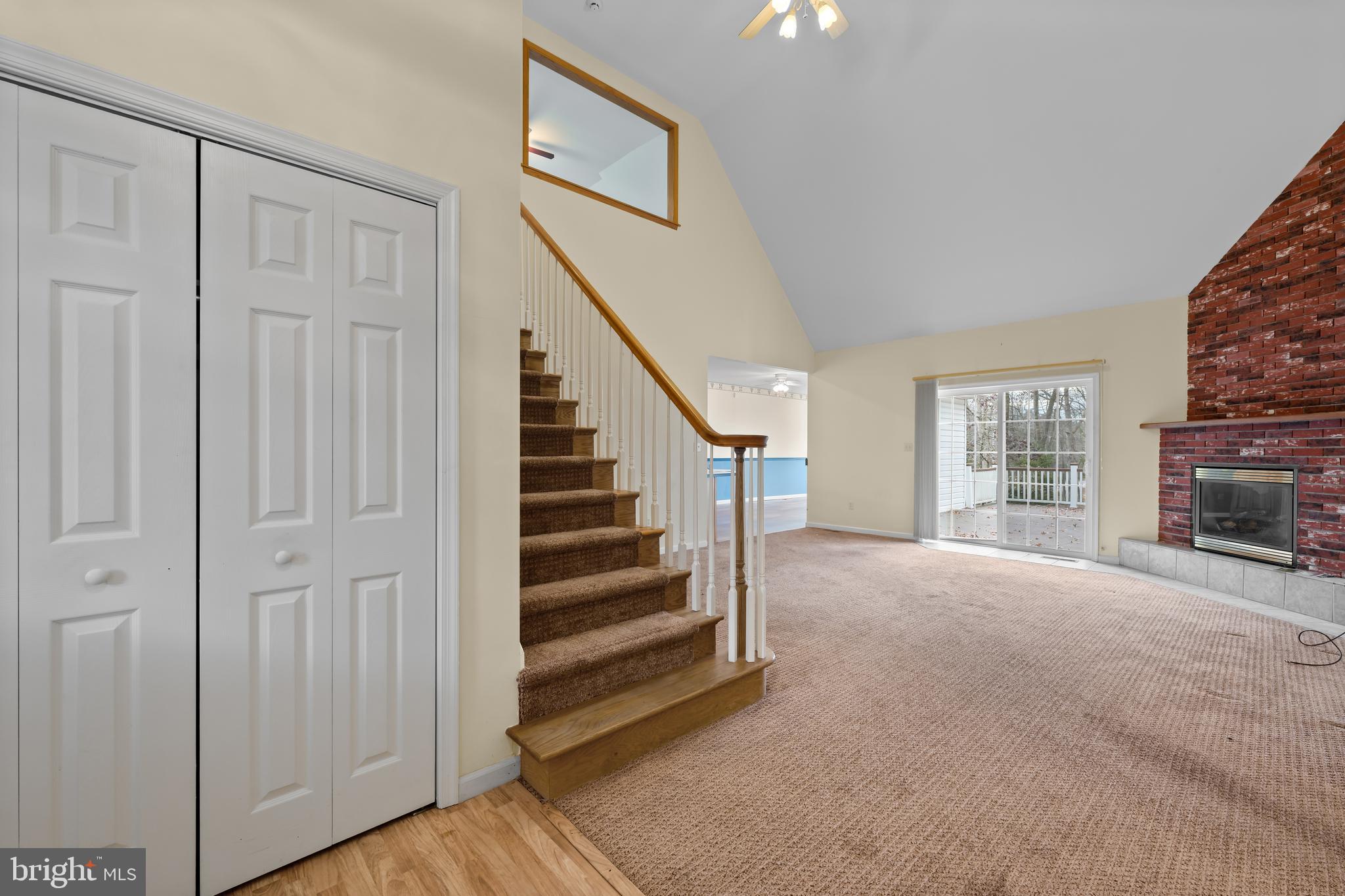 1 Pinewood Circle Hazleton, PA 18202 - Photo 7 of 33 a view of a livingroom with wooden floor stairs and a way to kitchen