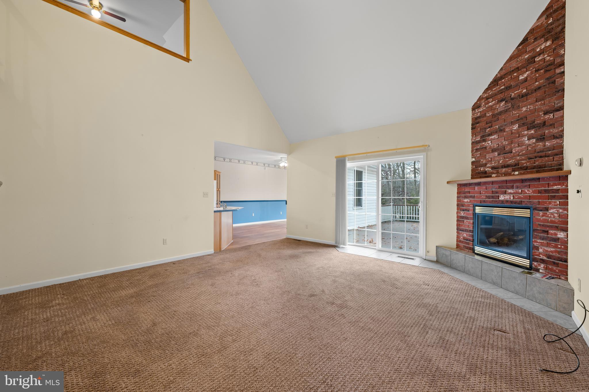 1 Pinewood Circle Hazleton, PA 18202 - Photo 8 of 33 a view of an empty room with a fireplace and a window