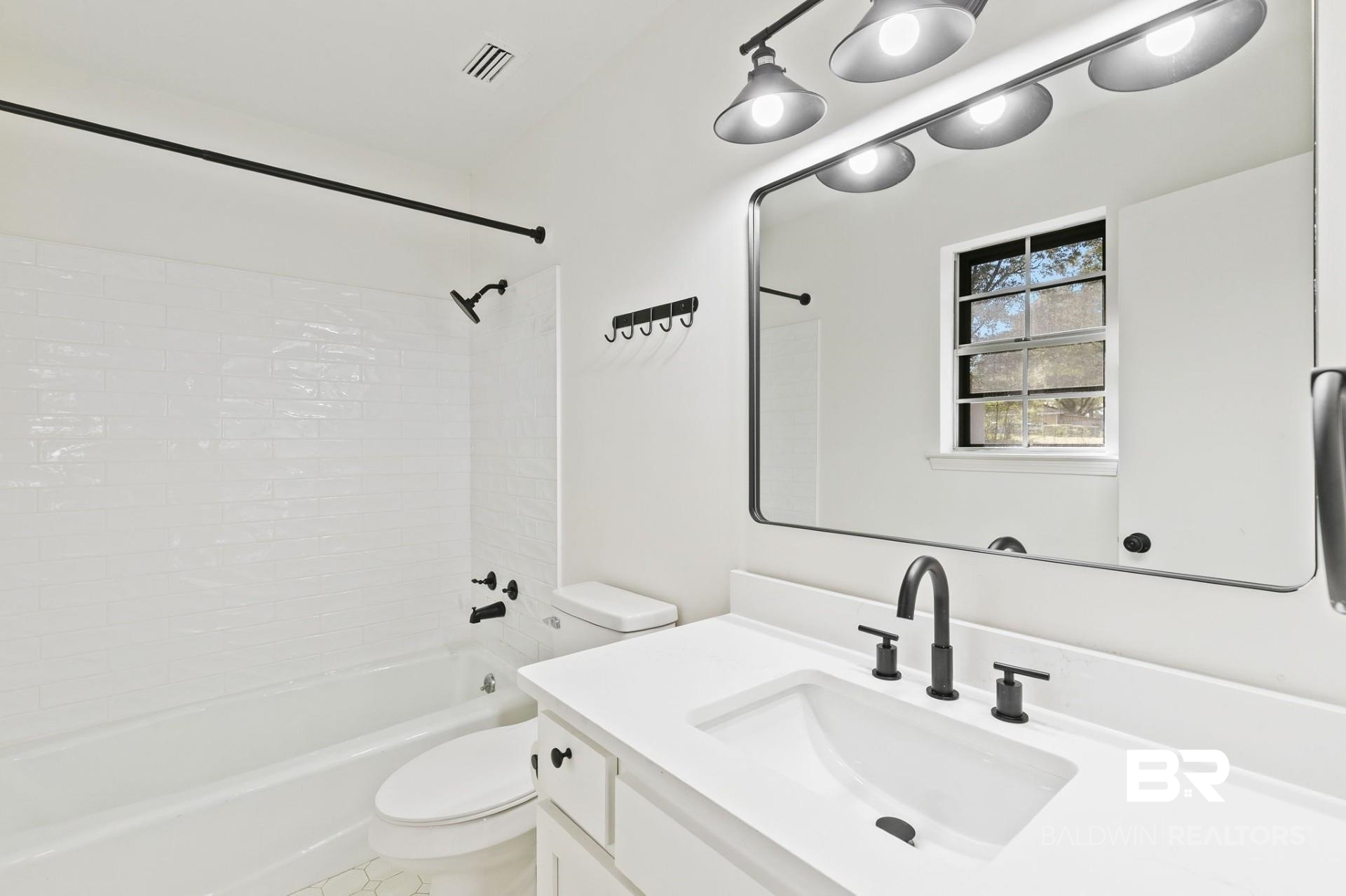 3270 Graham Road North Mobile, AL 36618 - Photo 29 of 54 Full bathroom with toilet, shower / bathtub combination, and vanity