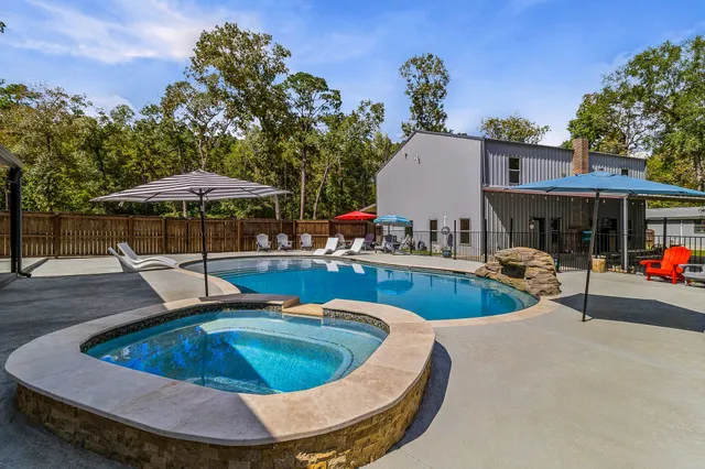a view of a swimming pool with a patio