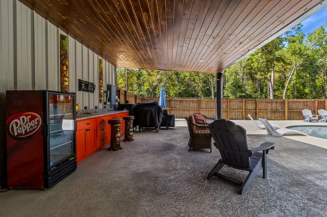 an aerial view of a house with outdoor space