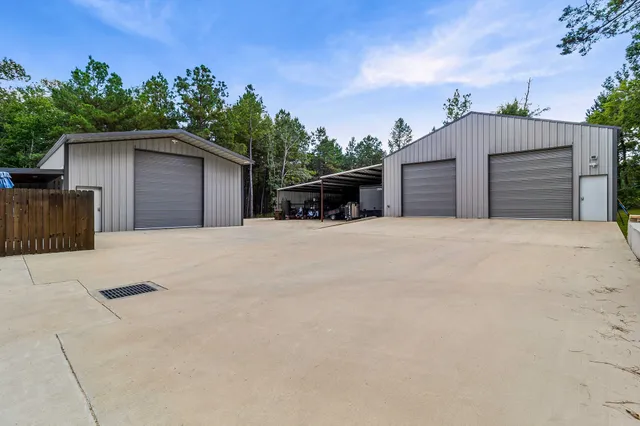 a view of a house with a yard and a garage